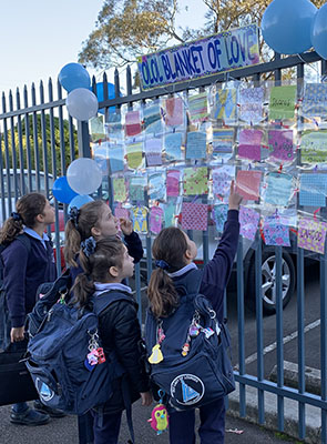 Our Lady of Lourdes Catholic Primary School Eastwood students look for their Blanket of Love patch