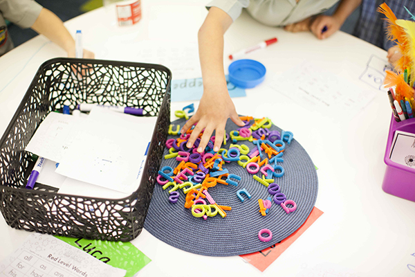 Kids play games with letters of the alphabet