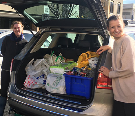 St Mary's Catholic Primary School North Sydney parents Eilish Reville and Felicity Clarkin loading up donations in the school carpark