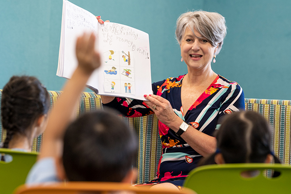 St Therese Catholic Primary School Mascot principal Gabrielle McAnespie reading to her students