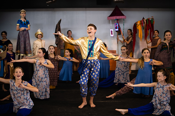 Students performing on stage