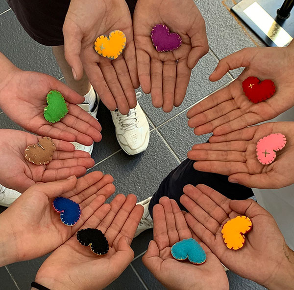 Marion Catholic Primary School Horsley Park students hold felt hearts made for staff at Fairfield Hospital