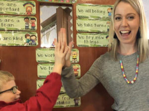 Sacred Heart Catholic Primary School Mosman Year 2 teacher, Miss Charlotte Allen high-fives a pupil