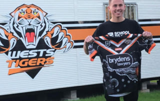 Marcellin College Randwick student Bill Reynolds with an NRL jersey he designed