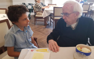 Pen pals Father Bernie and St Charles Catholic Primary School Ryde student Francis.