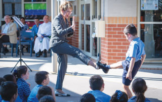 Governor of NSW Margaret Beazley and Holy Spirit Carness Hill student Nicholas doing karate moves