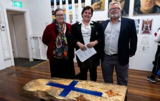 Southern Cross College Burwood student Charlotte McCaughan with her Clancy Prize artwork and parents