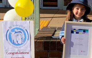 WriteOn 2020 winner Savannah with her writing awardfrom the NSW Education Standards Authority.