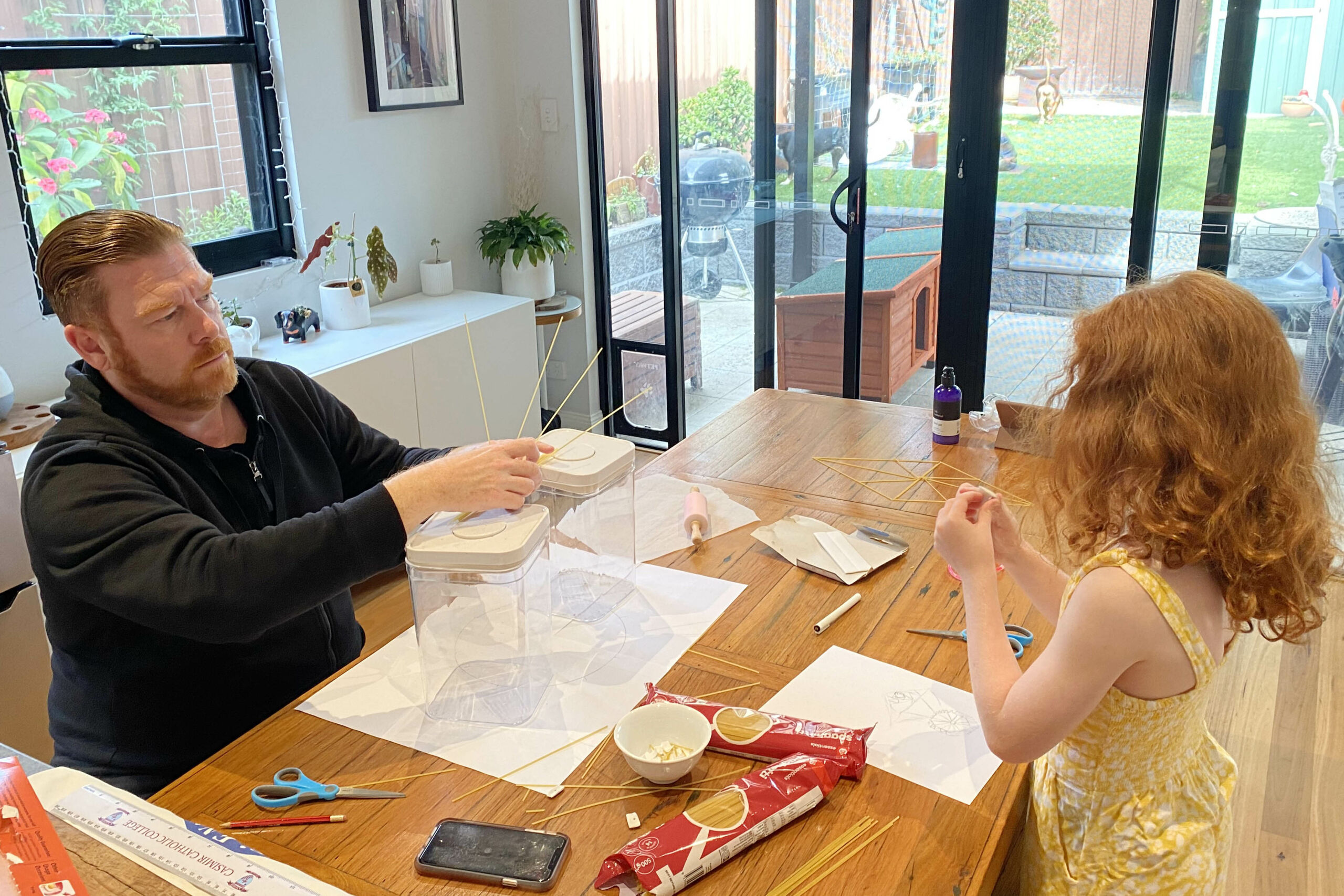 Father and daughter complete a STEM family challenge.