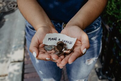 Hands holding change